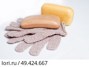 high-grade natural aroma soaps with washing mitten at wite background. Стоковое фото, агентство Ingram Publishing / Фотобанк Лори