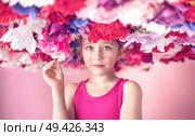 Cute little cutie among colorful flowers. Стоковое фото, агентство Ingram Publishing / Фотобанк Лори