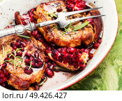Juicy, delicious pork chops with in pomegranate sauce. Meat steak with pomegranate. Стоковое фото, агентство Ingram Publishing / Фотобанк Лори