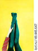 Pop art piece of young woman legs in tights against a yellow background                               . Стоковое фото, агентство Ingram Publishing / Фотобанк Лори