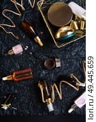 set of nature precious oils and  care cosmetics on black background . Стоковое фото, агентство Ingram Publishing / Фотобанк Лори