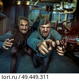 Two boys guys making a robbery. Стоковое фото, агентство Ingram Publishing / Фотобанк Лори