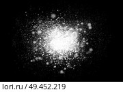 Freeze motion of white powder exploding, isolated on black, dark background. Abstract design of dust cloud. Particles explosion, screen saver wallpaper with copy space. Стоковое фото, агентство Ingram Publishing / Фотобанк Лори