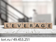 Leverage sign in a office environment on a wooden desk. Стоковое фото, агентство Ingram Publishing / Фотобанк Лори