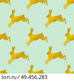 Golden Easter seamless pattern with rabbits on a green background. Vector illustration. Стоковая иллюстрация, агентство Ingram Publishing / Фотобанк Лори