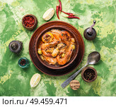 Traditional thai cuisine.Tom yum goong.Spicy shrimp soup. Spicy soup with seafood. Стоковое фото, агентство Ingram Publishing / Фотобанк Лори