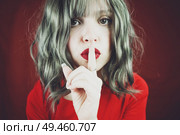   Elegant young woman doing silent gesture                             . Стоковое фото, агентство Ingram Publishing / Фотобанк Лори