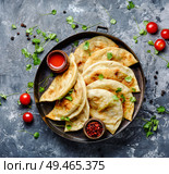 Cheburek, unleavened patty stuffed with minced meat.Traditional Tatar pastry. Cheburek,dough pie with meat filling. Стоковое фото, агентство Ingram Publishing / Фотобанк Лори