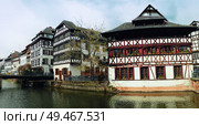 Traditional timber framing houses, Fachwerk architecture on picturesque canals in La Petite France, the medieval fairytale town of Strasbourg, UNESCO Heritage Site, Alsace, France. Beautiful panorama. Стоковое фото, агентство Ingram Publishing / Фотобанк Лори