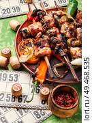Summer picnic with shashlik and lotto board game.Barbecue and board games.Kebab. Grilled meat and board games. Стоковое фото, агентство Ingram Publishing / Фотобанк Лори