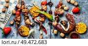Summer picnic with shashlik and lotto board game.Summer food. BBQ meat and lotto game. Стоковое фото, агентство Ingram Publishing / Фотобанк Лори