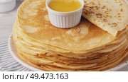 Traditional Russian pancakes with honey on a white wooden table. Homemade russian thin pancakes blini. Russian food, russian kitchen. Стоковое видео, видеограф Наталия Попова / Фотобанк Лори