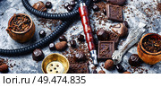 Oriental smoking hookah with a taste of chocolates. Chocolate tobacco flavor.. Tobacco shisha with chocolate flavor. Стоковое фото, агентство Ingram Publishing / Фотобанк Лори