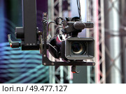 Professional video camera on a crane during an outdoor event. Стоковое фото, фотограф Евгений Ткачёв / Фотобанк Лори