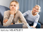 Sad teen girl after discord with her mother. Стоковое фото, фотограф Яков Филимонов / Фотобанк Лори