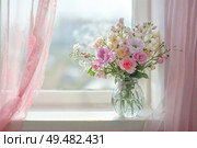 Pastel Floral Bouquet in Glass Vase on Bright Windowsill with Soft Pink Curtains. Стоковое AI-изображение, AI-художник Александра Конопля / Фотобанк Лори