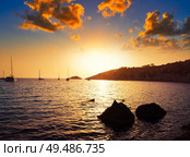 Ibiza cala d Hort with Es Vedra islet sunset in Sant Josep of Balearic Islands. Стоковое фото, агентство Ingram Publishing / Фотобанк Лори