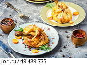 Chicken legs in pastry.Chicken leg in puff pastry on plate. Chicken drumstick baked in dough. Стоковое фото, агентство Ingram Publishing / Фотобанк Лори