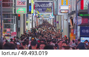 Osaka, Japan - Sep 22 2024, 4k, Panoramic view of Dotonbori street with various cafes, restaurants, bright signs and advertisements, illumination, a lot of people walking, at night, Osaka, Japan. Редакционное видео, видеограф Сергей Богомяко / Фотобанк Лори