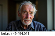 An older man with silver hair and a warm smile gazes thoughtfully, hinting at stories untold. Soft light casts a serene ambiance in this intimate indoor setting Generative AI. Стоковое AI-изображение, AI-художник Юлия Петровская / Фотобанк Лори