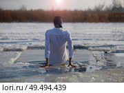 Swimming in cold water.Feast of the baptism of the god Jesus. Russian tradition.Lupine in icy prob.Chastity's of sins.Lag in the cold river. Epiphany frosts. Стоковое фото, фотограф Лазаренко Светлана / Фотобанк Лори