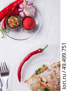international vegetarian  shawarma sandwich roll with chili and spices. served at white table. arabian and caucaisian cuisine. Healthy fast food. flat lay. Стоковое фото, агентство Ingram Publishing / Фотобанк Лори