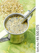 Yerba mate in calabash and dry herb.Traditional argentinian beverage. Yerba mate tea in a calabash gourd. Стоковое фото, агентство Ingram Publishing / Фотобанк Лори