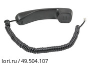 Чёрная телефонная трубка с витым проводом на белом фоне. A black handset with a twisted wire on a white background. Стоковое фото, фотограф Татьяна Д / Фотобанк Лори