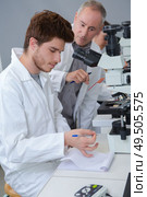 student documenting his observation. Стоковое фото, агентство Ingram Publishing / Фотобанк Лори