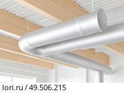 Modern industrial ceiling with exposed ductwork and wooden beams. Стоковое AI-изображение, AI-художник Мария Фадеева / Фотобанк Лори