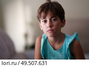Little girl, eight years old, looking at camera seriously at home. Little girl, eight years old, looking at camera seriously. Стоковое фото, агентство Ingram Publishing / Фотобанк Лори