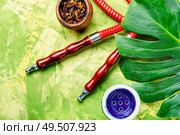 Smoking hookah.Details of Turkish hooka.Shisha with a fruity aroma of tobacco.. Oriental smoking hookah. Стоковое фото, агентство Ingram Publishing / Фотобанк Лори