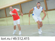 team of men playing pala. Стоковое фото, агентство Ingram Publishing / Фотобанк Лори