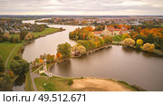 Autumn aerial view of Medieval castle in Nesvizh. Colorful maple park in Niasvizh ancient town. Minsk Region, Belarus. Стоковое фото, агентство Ingram Publishing / Фотобанк Лори