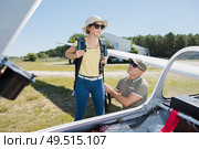 young woman going on board a glider. Стоковое фото, агентство Ingram Publishing / Фотобанк Лори