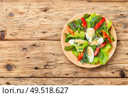 Spring diet salad with greens and egg.Salad with egg,sorrel and pepper. Vegetable salad with egg. Стоковое фото, агентство Ingram Publishing / Фотобанк Лори