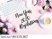 New 2020 year resolutions modern keyboard with female accessories and fresh peony flowers, copy space on pink background. Top view home office workspace. Стоковое фото, агентство Ingram Publishing / Фотобанк Лори