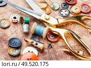 Sewing tools, scissors, many buttons and threads. Set of sewing accessories. Стоковое фото, агентство Ingram Publishing / Фотобанк Лори
