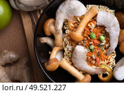 cooking spicy instant noodles soup with shrimps and  mushrooms. flat lay. close up. Стоковое фото, агентство Ingram Publishing / Фотобанк Лори