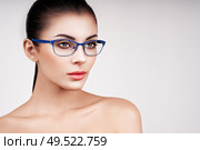 Woman with long eyelashes in eyeglasses. Vision correction. Poor eyesight. Spectacle frame. Makeup, cosmetics, beauty. Close up, macro. Стоковое фото, агентство Ingram Publishing / Фотобанк Лори