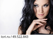 Beautiful curly-haired girl on a white background. Стоковое фото, агентство Ingram Publishing / Фотобанк Лори