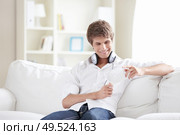 A young man is considering a disc. Стоковое фото, агентство Ingram Publishing / Фотобанк Лори