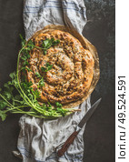 Savory pie with Phyllo dough. Su boregi, burek or borek on dark rustic background. Top view. Turkish cuisine. Стоковое фото, агентство Ingram Publishing / Фотобанк Лори