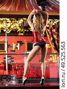 The attractive girl dances a striptease in club. Стоковое фото, агентство Ingram Publishing / Фотобанк Лори