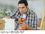 working man practising his skills in making drawer at workshop. Стоковое фото, агентство Ingram Publishing / Фотобанк Лори