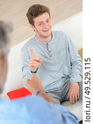 son and father during discussion. Стоковое фото, агентство Ingram Publishing / Фотобанк Лори