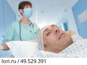 close-up of an injured man on a stretcher. Стоковое фото, агентство Ingram Publishing / Фотобанк Лори