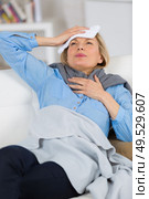 suffering woman is holding her head. Стоковое фото, агентство Ingram Publishing / Фотобанк Лори