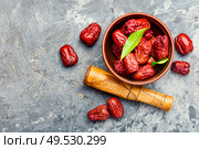 Bowl of dried unabi fruit or jujube.Space for text. Unabi fruits or ziziphus. Стоковое фото, агентство Ingram Publishing / Фотобанк Лори