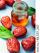 Healing tincture from unabi fruit or jujube.Chinese medicine. Jujube or ziziphus. Стоковое фото, агентство Ingram Publishing / Фотобанк Лори